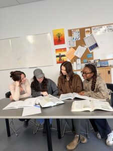 Small group analyzing several journal articles together