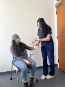 Nurse taking a patient's pulse